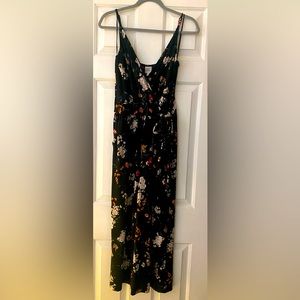 Floral jumper with long pants, spaghetti strap, and attached waist tie.